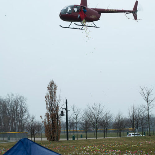 Helicopter dropping eggs at the WFCU Easter Egg Drop