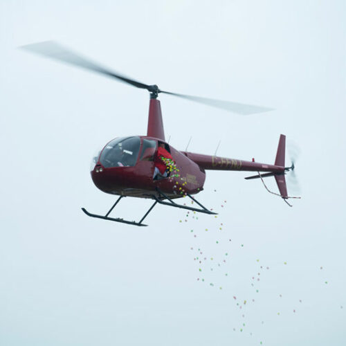 Helicopter dropping eggs at the WFCU Easter Egg Drop