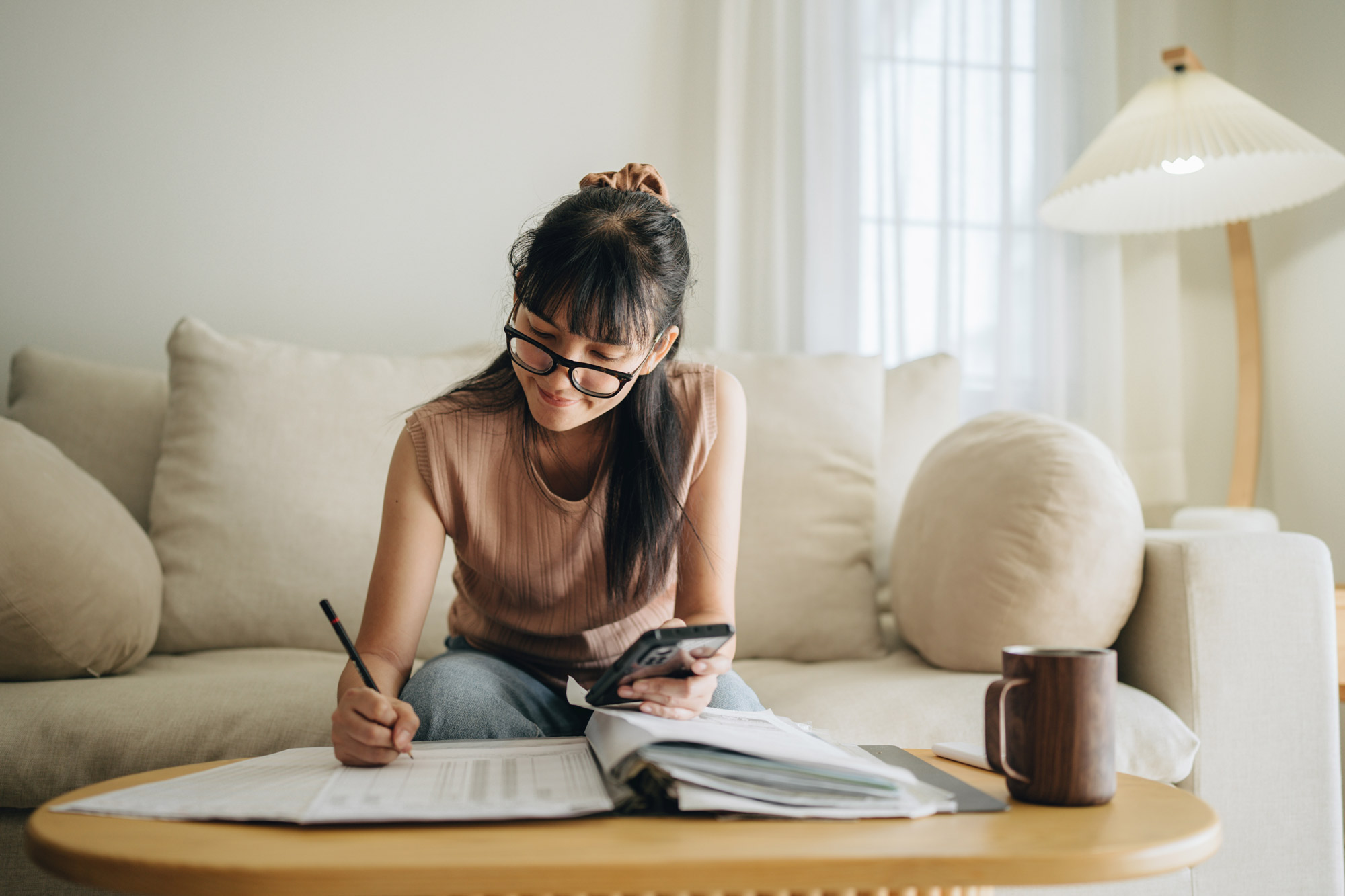 Woman making bill payments on time