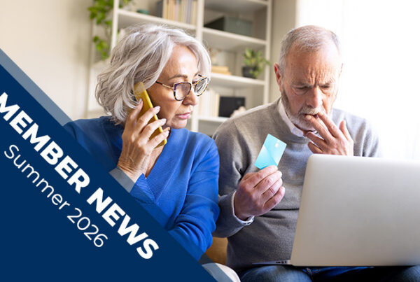 Member News Summer 2026 cover featuring two older adults using a laptop, with one person on a phone and the other holding a payment card.